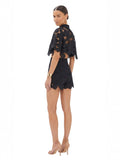 Paula Fashion House black high-waist shorts with floral cutwork and scalloped hem, worn by a model.